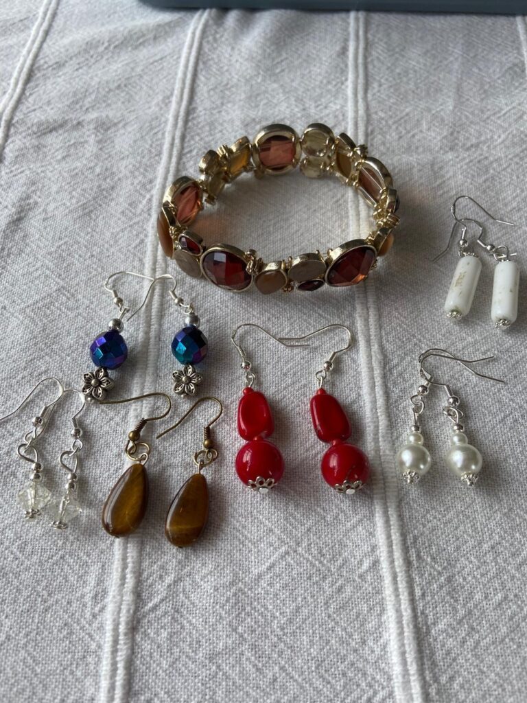 Assorted Earrings and a Necklace made and refurbished by our group members at a recent meeting